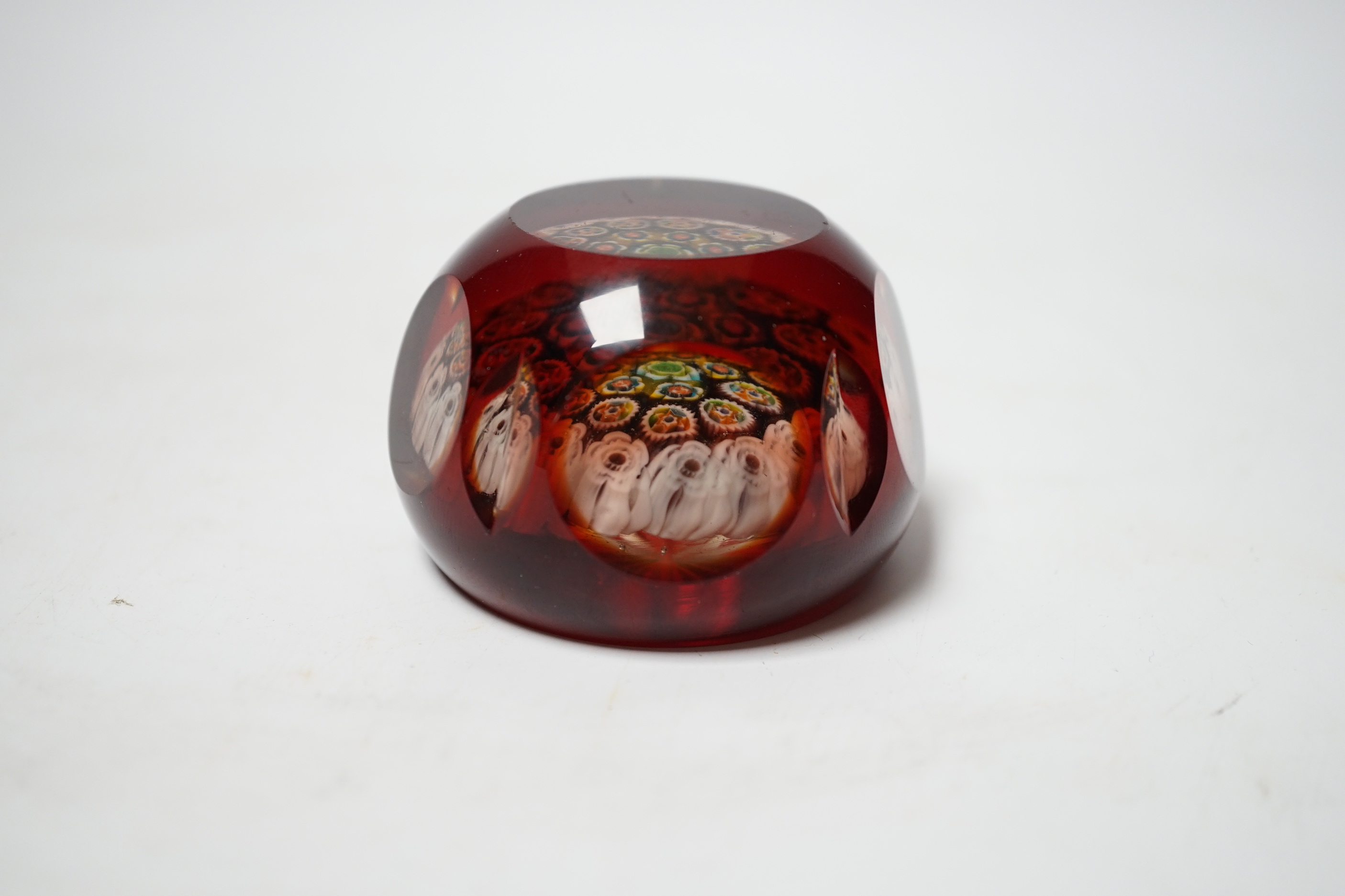 A 19th century ruby overlaid cut glass paperweight, 6cm diameter